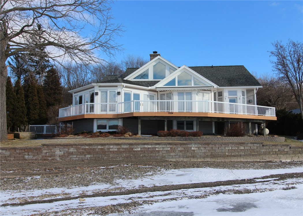 5524 East Lake Road Conesus, NY 14435 - Photo 1 of 1 View of the house from the lake. Note the shale b