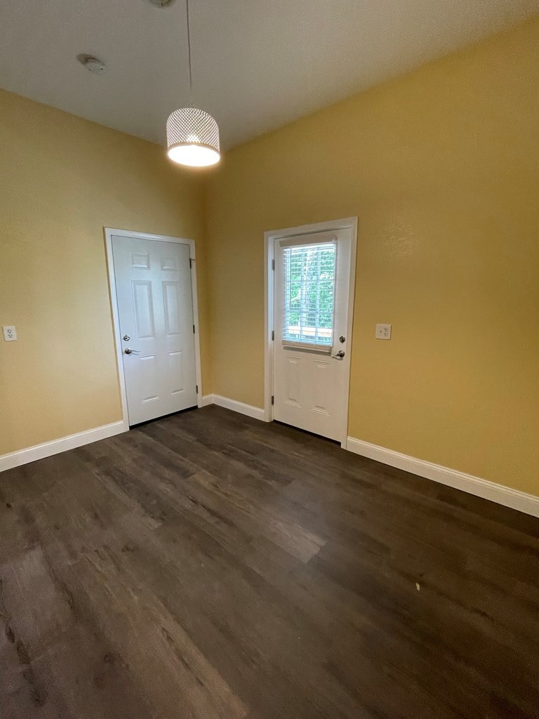 1763 Rays Gap Road Seymour, TN 37865 - Photo 29 of 34 a view of empty room with wooden floor and fan