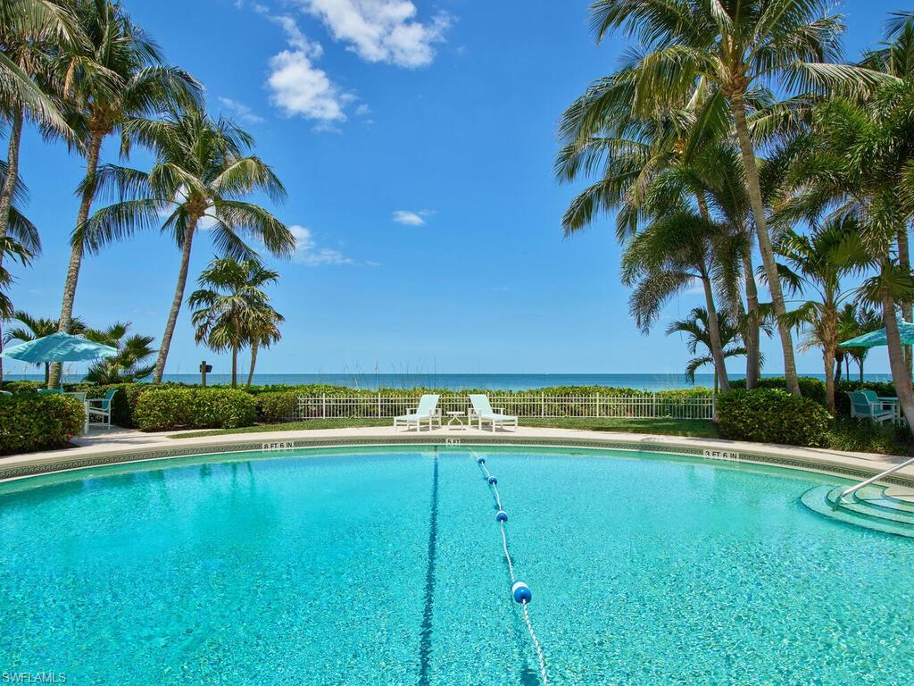 3003 Gulf Shore Boulevard North, Unit 604 Naples, FL 34103 - Photo 2 of 33 a view of a swimming pool and an outdoor space