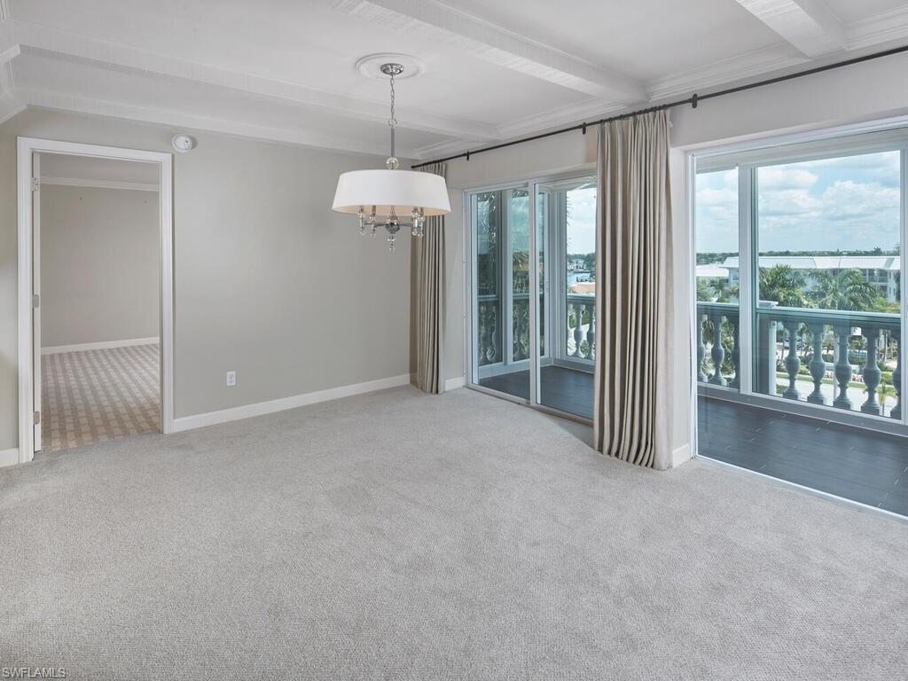 3003 Gulf Shore Boulevard North, Unit 604 Naples, FL 34103 - Photo 21 of 33 a view of a room with a windows and ceiling fan
