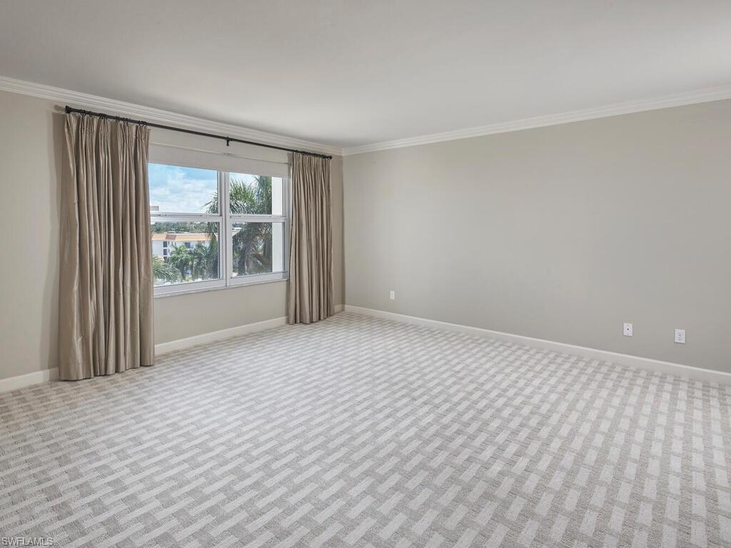 3003 Gulf Shore Boulevard North, Unit 604 Naples, FL 34103 - Photo 22 of 33 a view of an empty room with a window