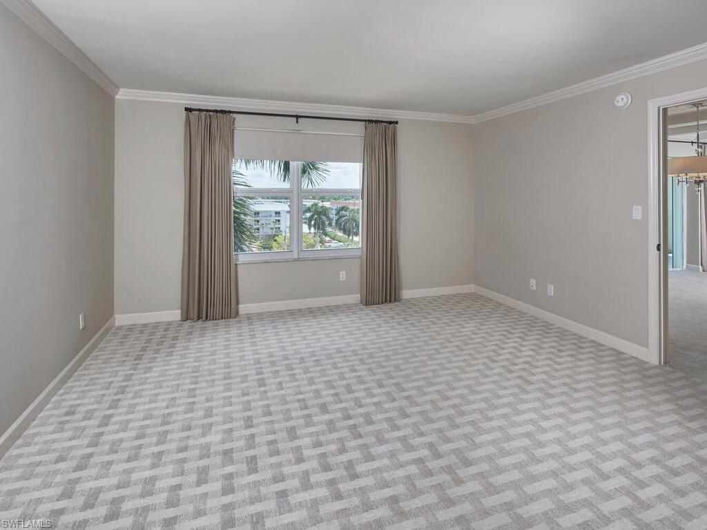 3003 Gulf Shore Boulevard North, Unit 604 Naples, FL 34103 - Photo 23 of 33 a view of an empty room and window