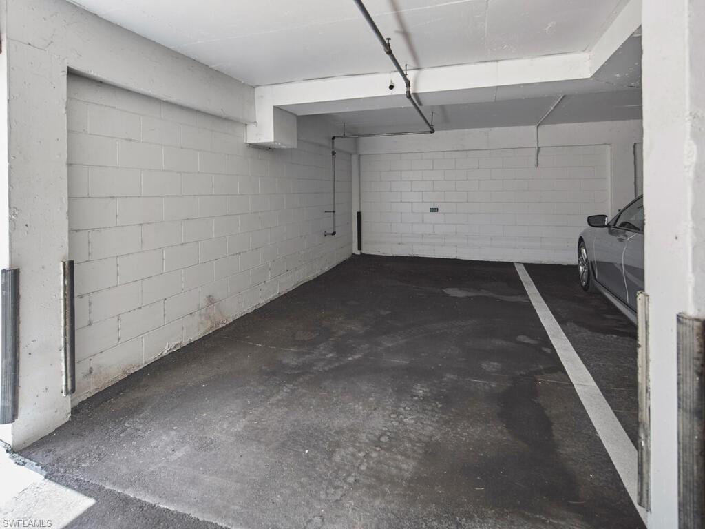 3003 Gulf Shore Boulevard North, Unit 604 Naples, FL 34103 - Photo 25 of 33 a view of a garage