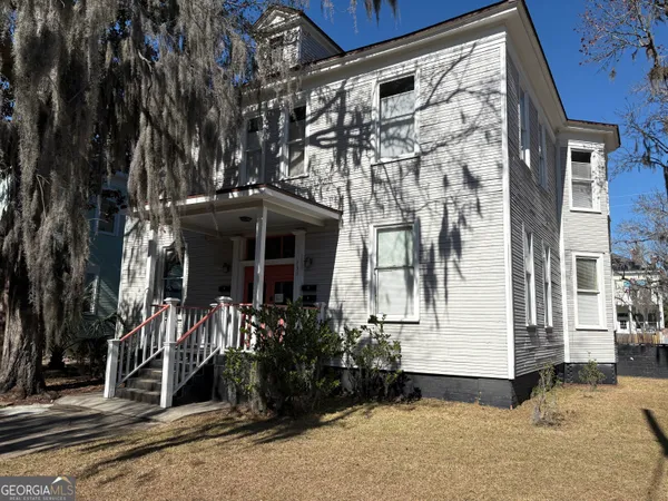 front view of a house with a yard