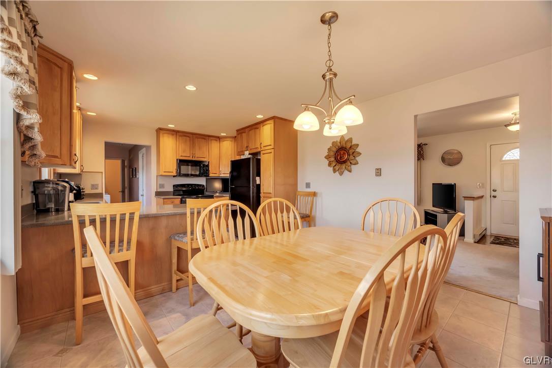255 Filetown Road Nazareth, PA 18064 - Photo 14 of 29 a dining room filled with furniture and a chandelier