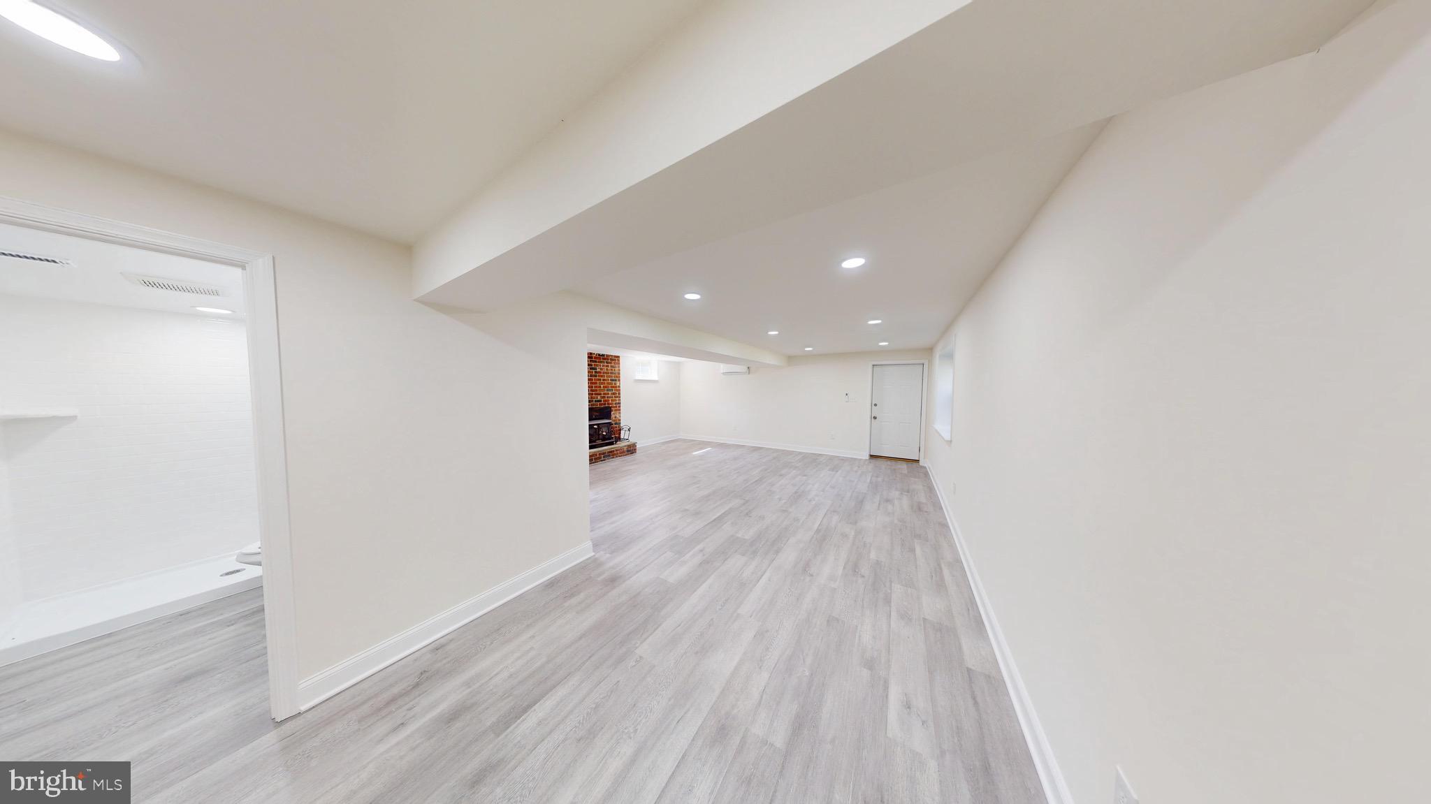 729 West Watersville Road Mount Airy, MD 21771 - Photo 31 of 42 a view of a big room with wooden floor and windows