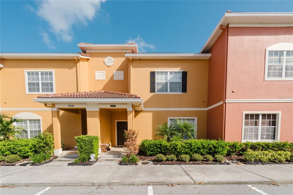 8961 Majesty Palm Road Kissimmee, FL 34747 - Photo 31 of 40 front view of a brick house with a large windows