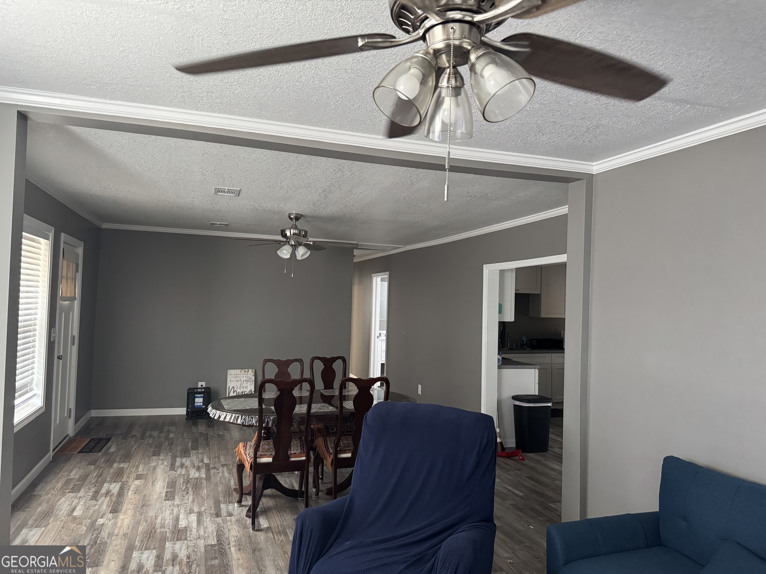 10 Grove Street Hazlehurst, GA 31539 - Photo 3 of 15 a view of a livingroom with furniture and a chandelier fan