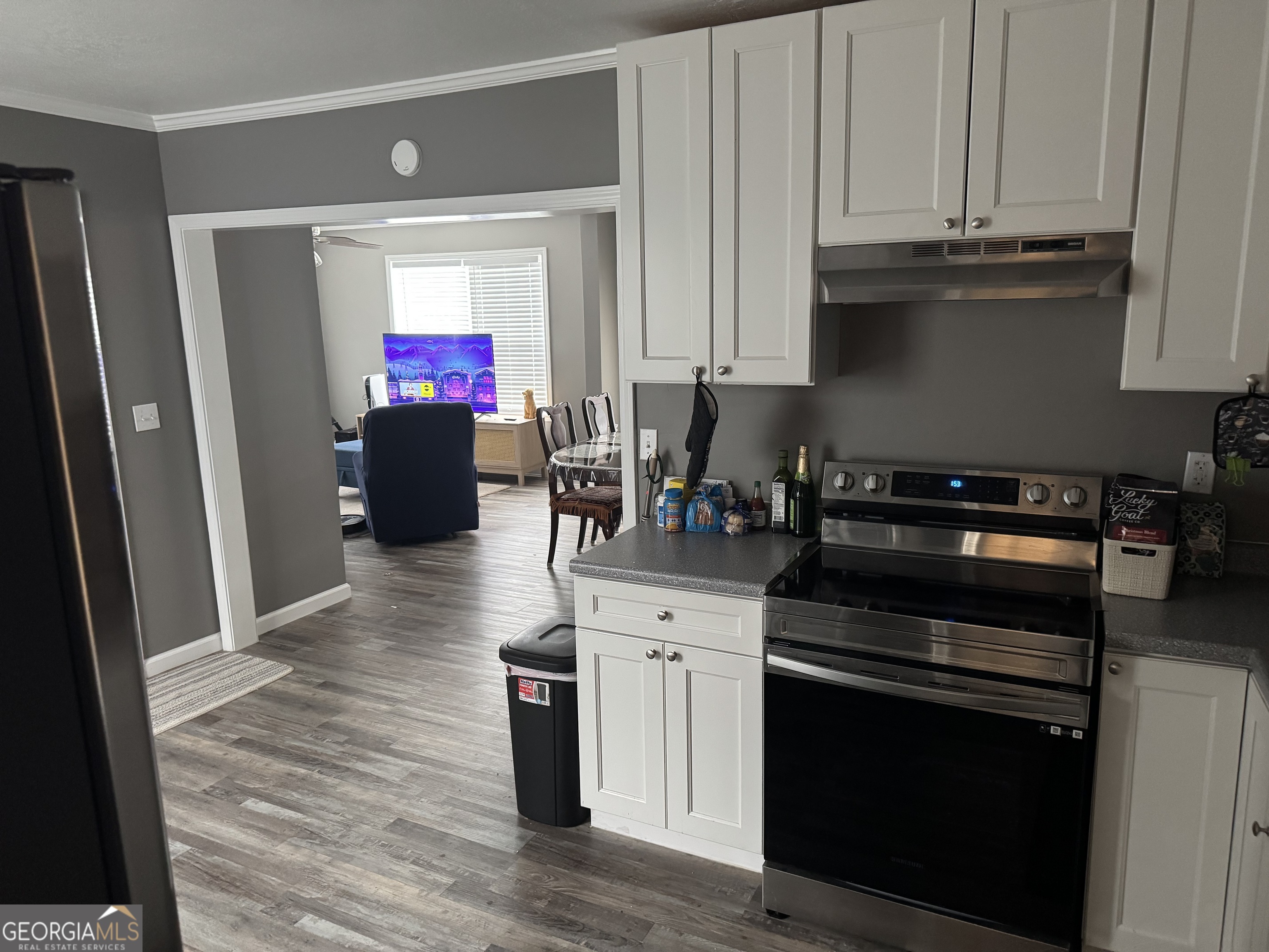 10 Grove Street Hazlehurst, GA 31539 - Photo 5 of 15 a kitchen with stainless steel appliances granite countertop a stove a refrigerator and a microwave