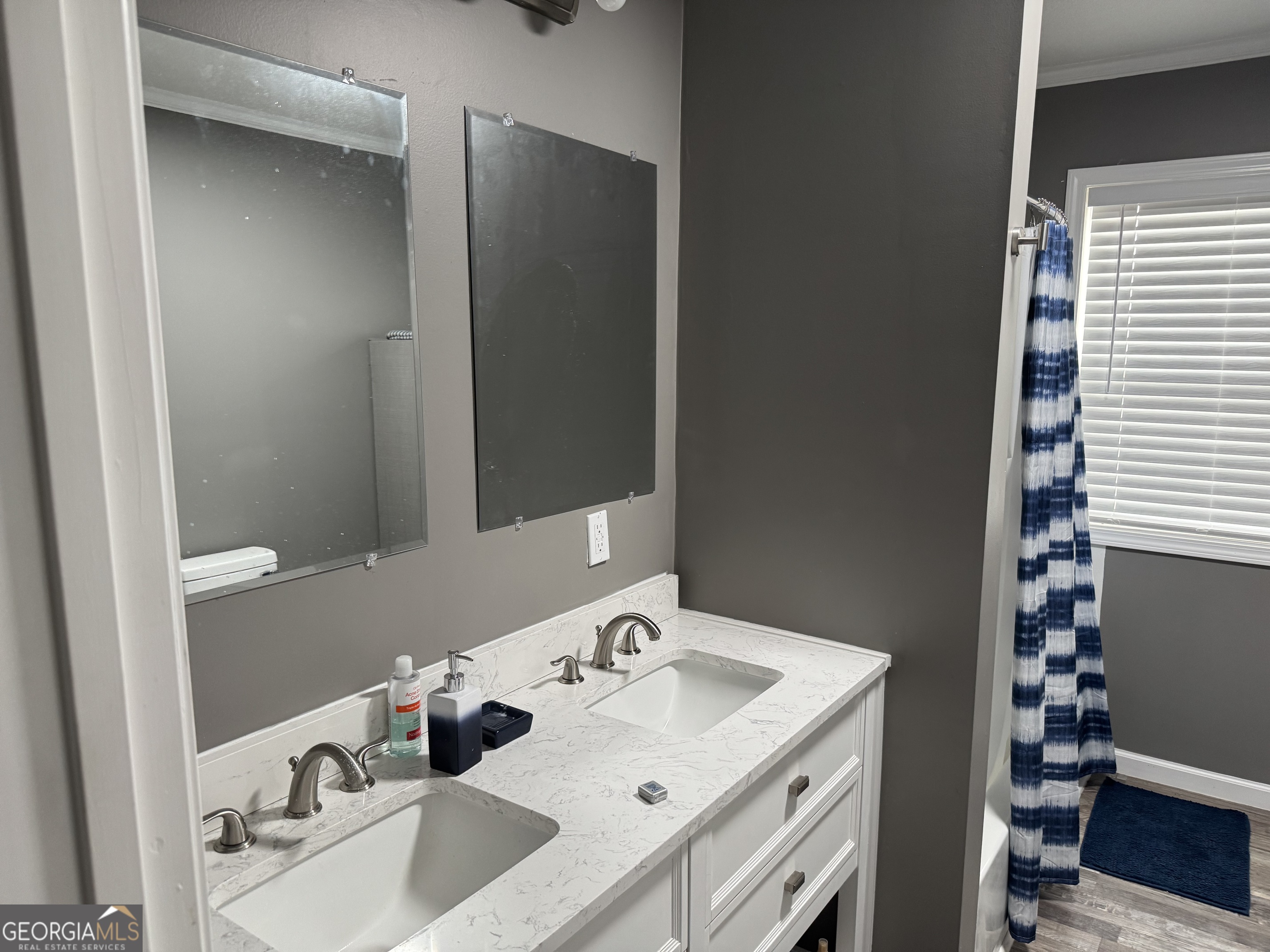10 Grove Street Hazlehurst, GA 31539 - Photo 6 of 15 a bathroom with a sink and a mirror