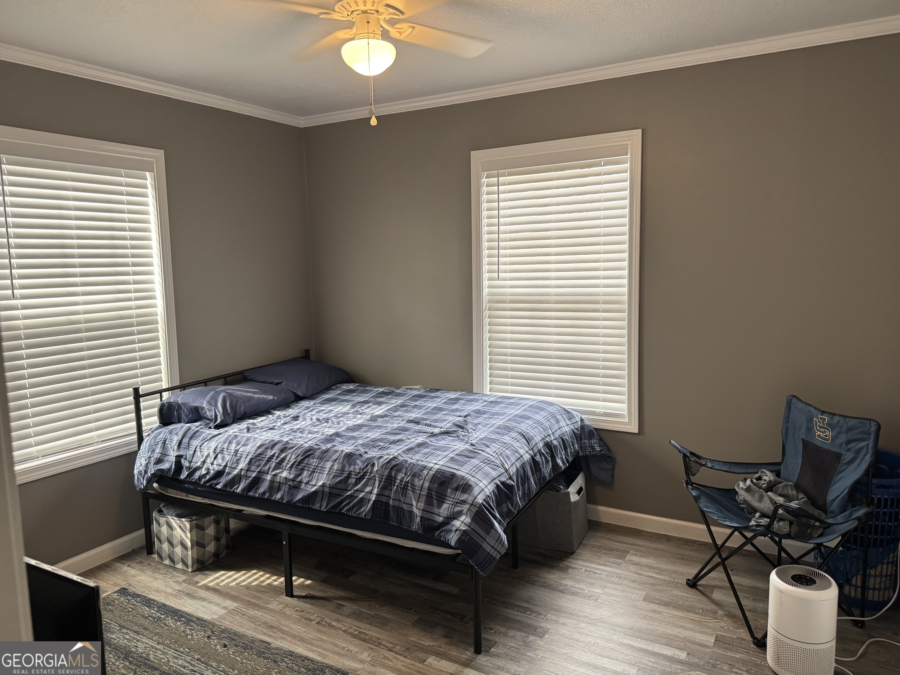 10 Grove Street Hazlehurst, GA 31539 - Photo 8 of 15 a bedroom with a bed and chair