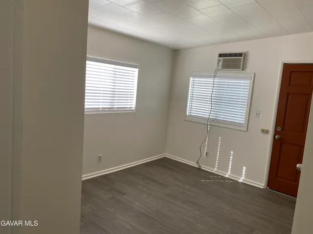 a white toilet sitting next to a shower