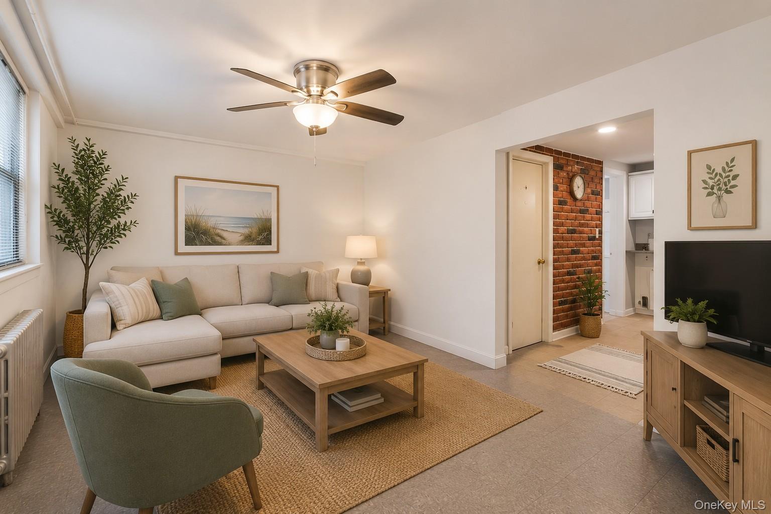 a living room with furniture a ceiling fan and a window