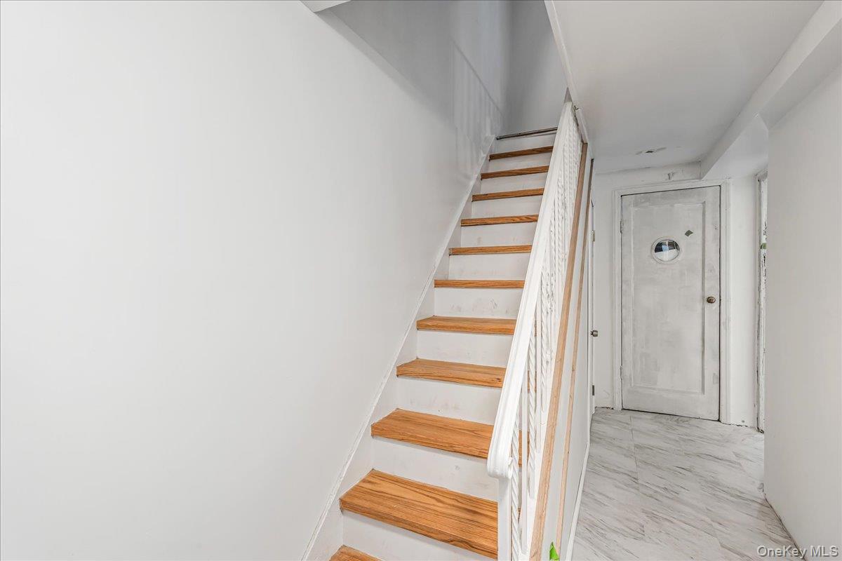57-39 57th Road Queens, NY 11378 - Photo 15 of 31 a view of entryway with stairs