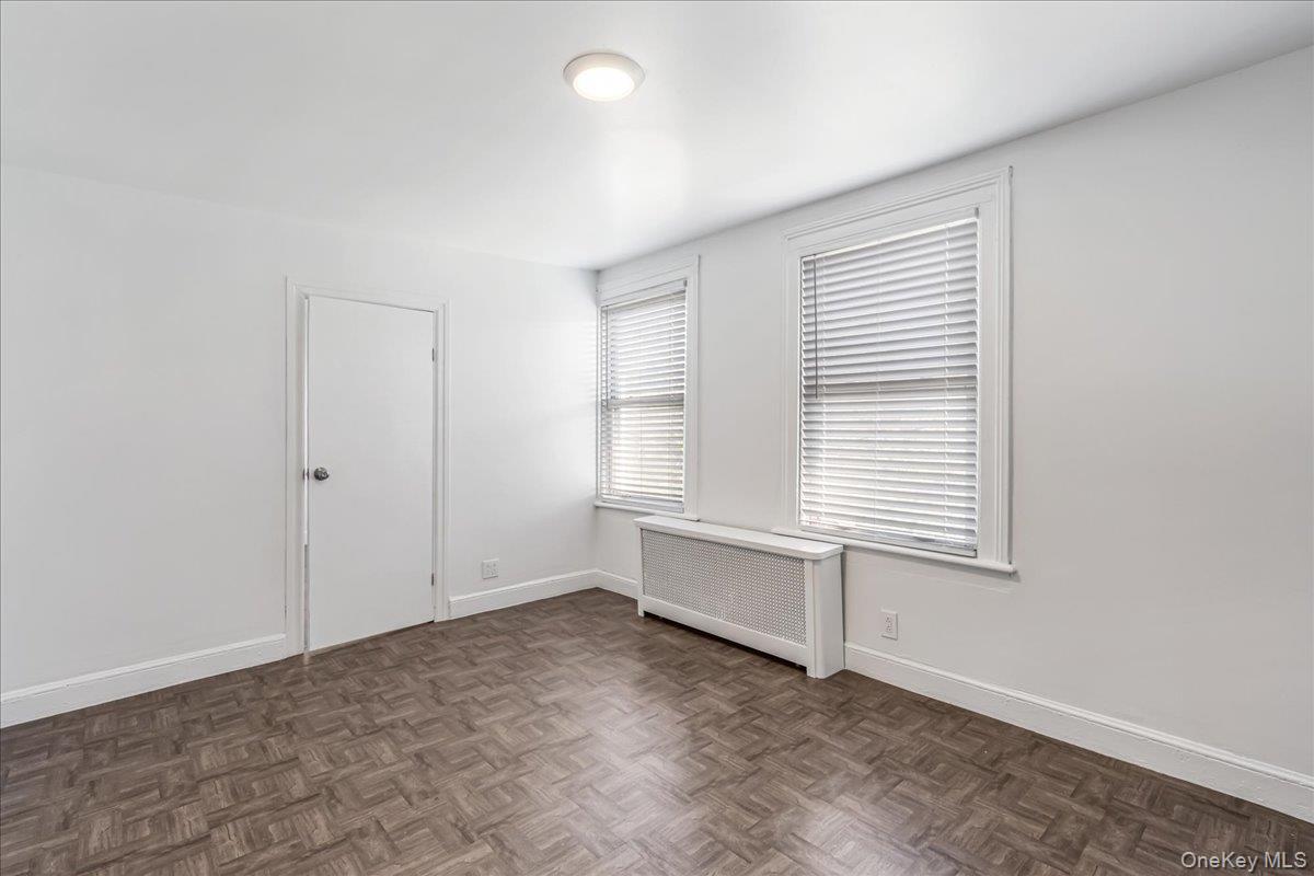57-39 57th Road Queens, NY 11378 - Photo 18 of 31 an empty room with a window