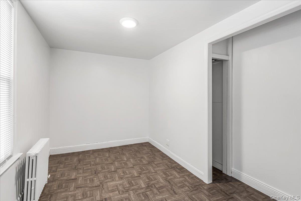 57-39 57th Road Queens, NY 11378 - Photo 21 of 31 a view of a room with wooden floor