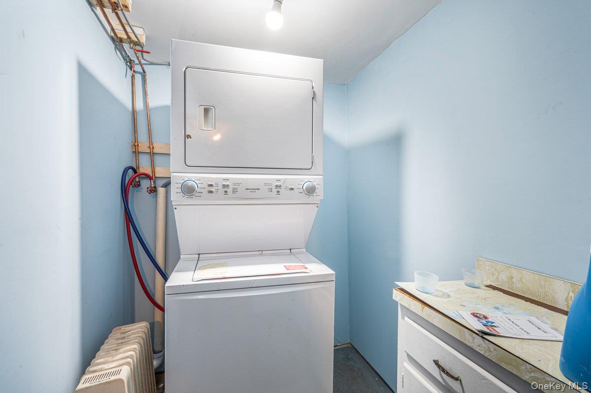 57-39 57th Road Queens, NY 11378 - Photo 24 of 31 a utility room with dryer and washer