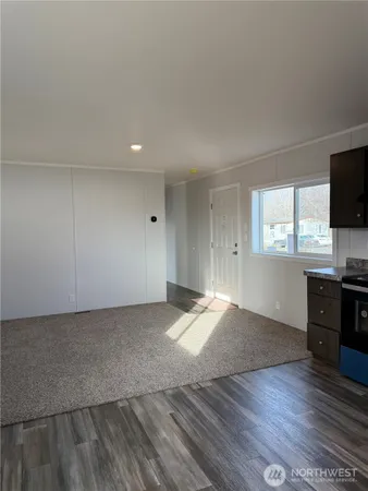 a room with a table and wooden floor