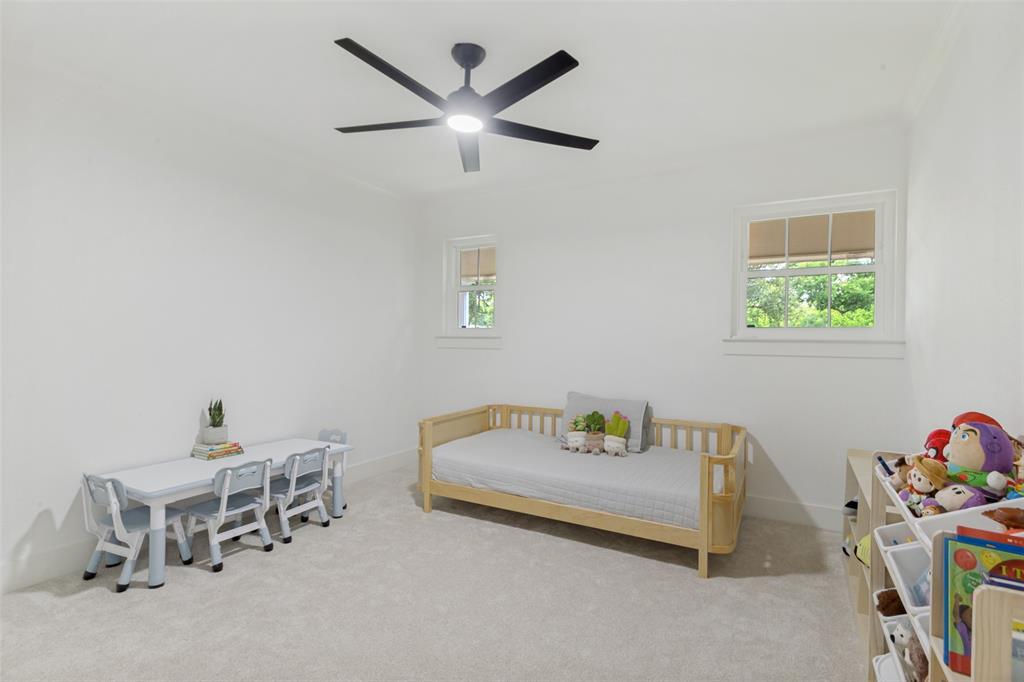4316 Springbranch Drive Benbrook, TX 76116 - Photo 29 of 39 Carpeted room featuring a ceiling fan, two windows with blinds, and white walls