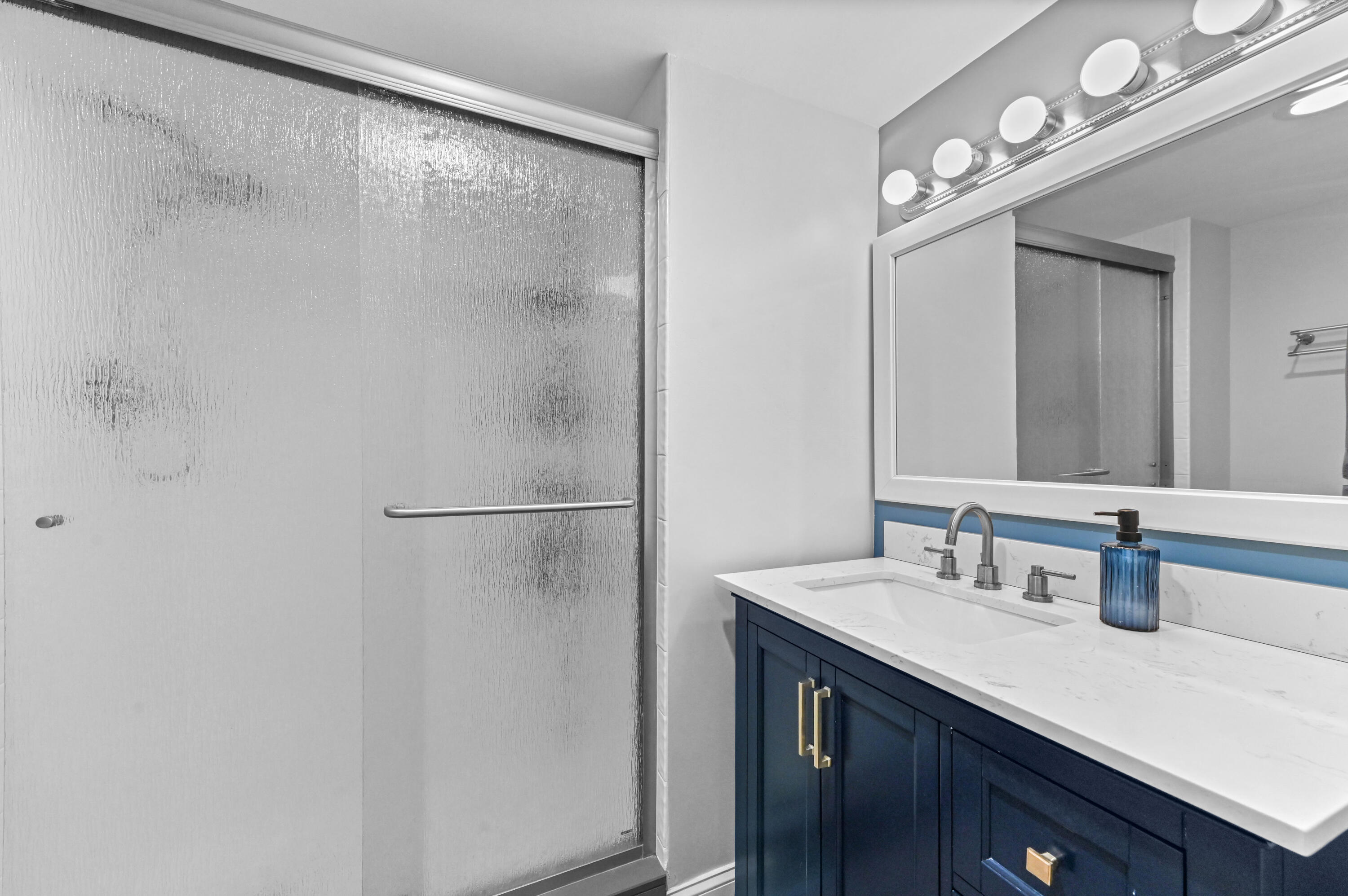 198 Northwest 67th Street, Unit 207 Boca Raton, FL 33487 - Photo 26 of 42 a bathroom with a sink and a mirror