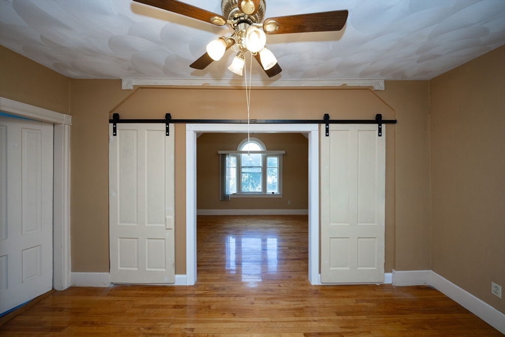 35 Tirrell Street, Unit 3 Worcester, MA 01603 - Photo 6 of 9 a view of empty room with wooden floor and fan