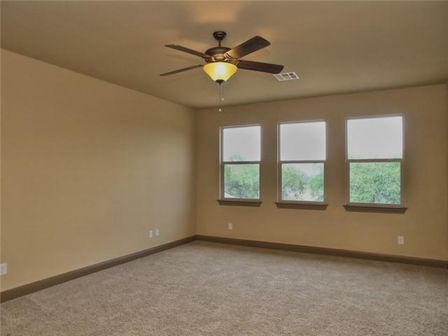 104 Vista Lane Georgetown, TX 78633 - Photo 26 of 36 The Media or guest suite offers a full bath and closet and overlooks the expansive back yard.