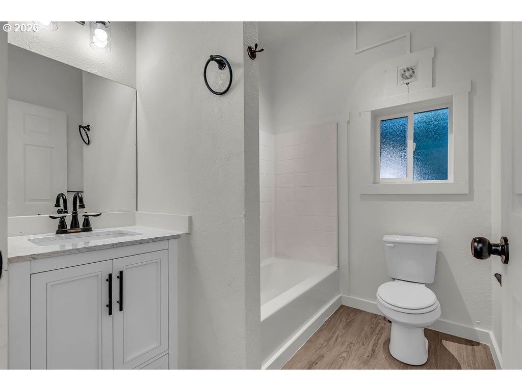 1477 June Way Woodburn, OR 97071 - Photo 27 of 34 a bathroom with a toilet a sink and mirror