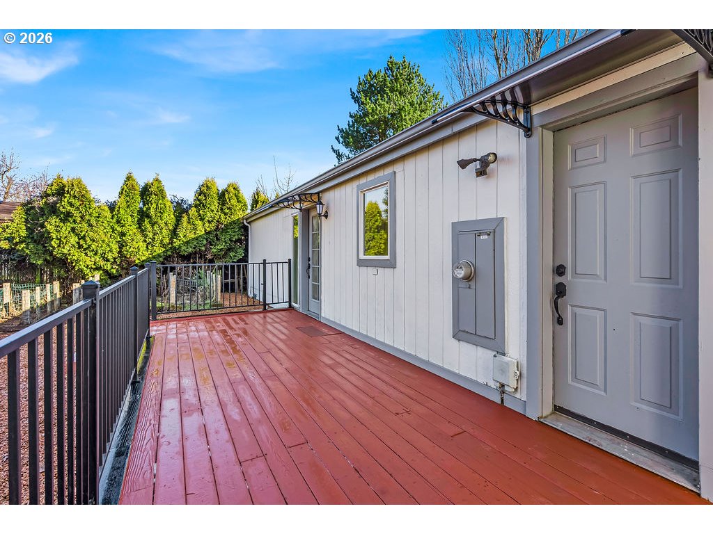 1477 June Way Woodburn, OR 97071 - Photo 30 of 34 a view of backyard with a deck and wooden floor