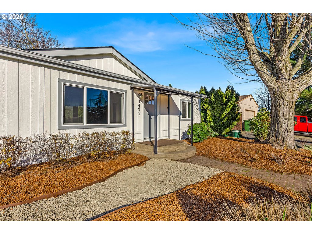 1477 June Way Woodburn, OR 97071 - Photo 6 of 34 a front view of a house with a yard