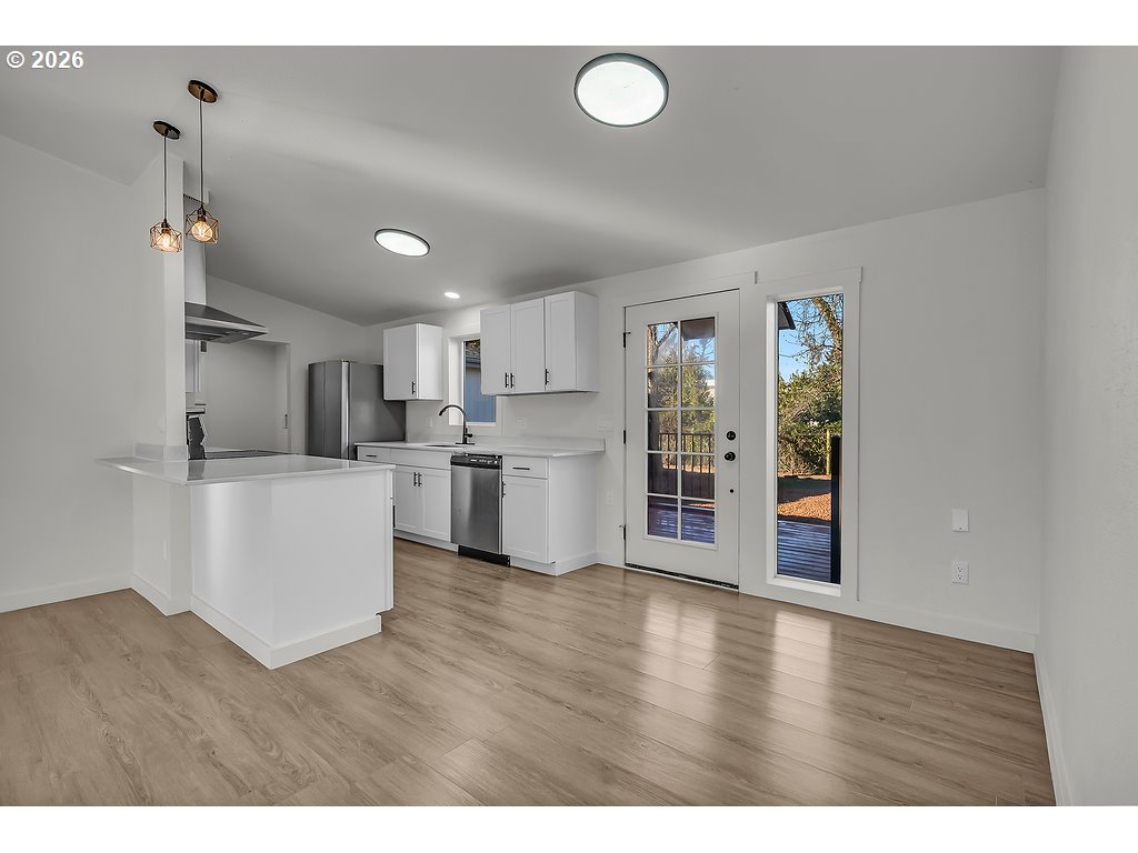 1477 June Way Woodburn, OR 97071 - Photo 9 of 34 a view of kitchen with wooden floor