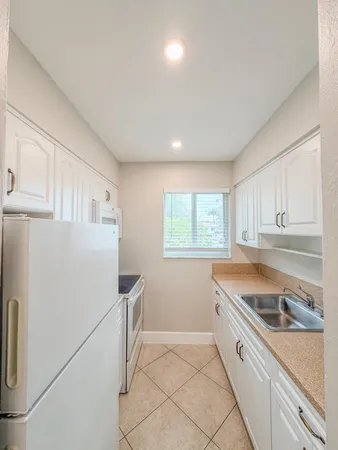 a view of a backyard with pathway