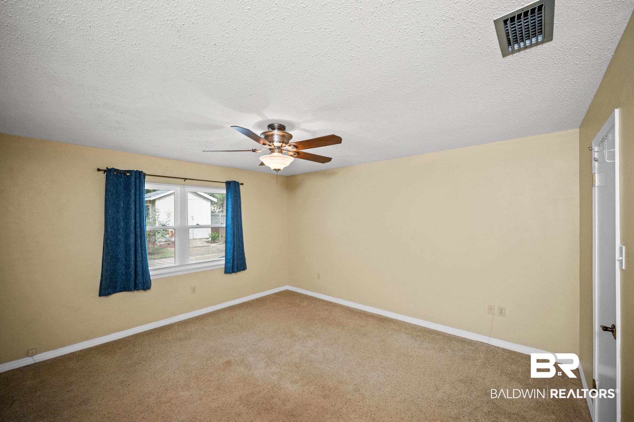 123 Dunbar Loop Daphne, AL 36526 - Photo 13 of 33 Carpeted empty room featuring a textured ceiling and ceiling fan