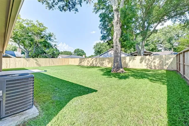 a view of backyard with green space