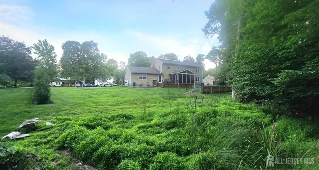 a view of a house with a big yard