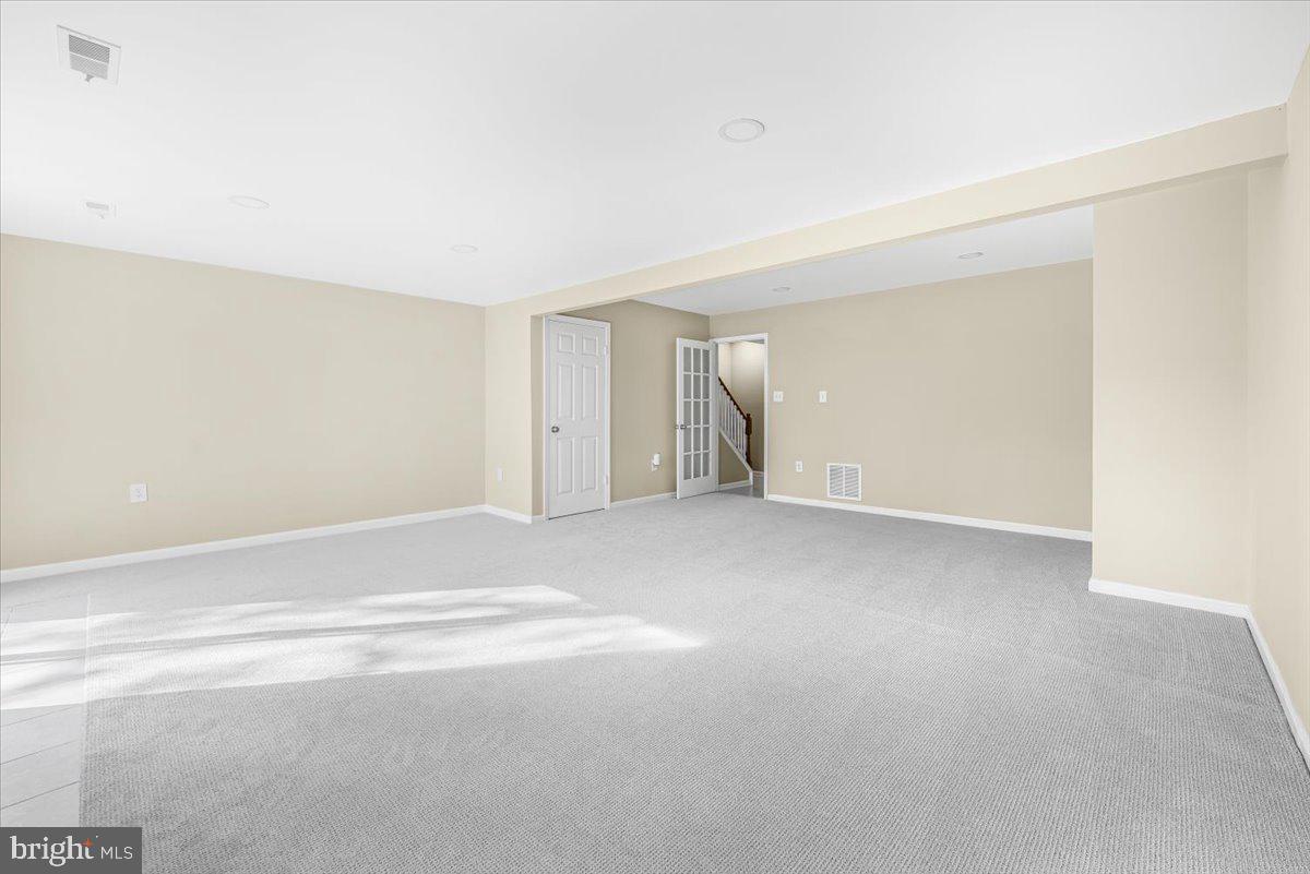 1936 Flowering Tree Terrace Silver Spring, MD 20902 - Photo 17 of 26 a view of an empty room