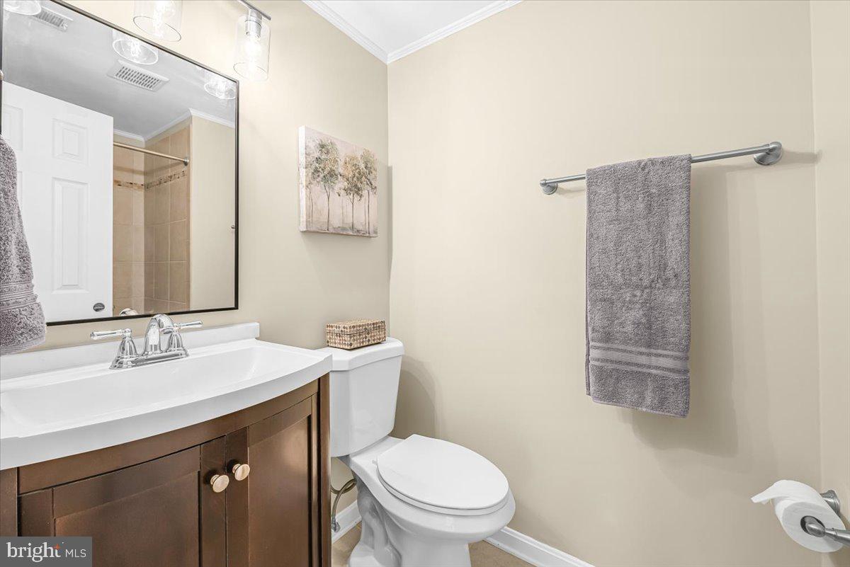 1936 Flowering Tree Terrace Silver Spring, MD 20902 - Photo 18 of 26 a bathroom with a sink a toilet and shower