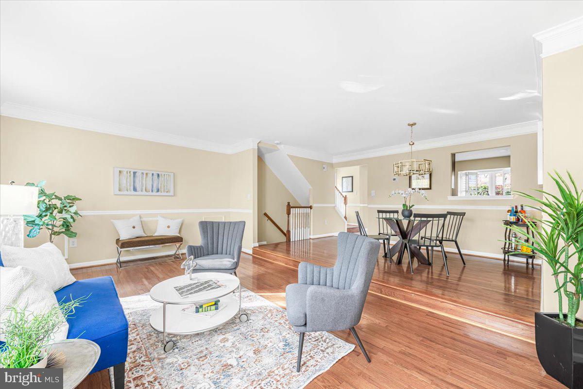1936 Flowering Tree Terrace Silver Spring, MD 20902 - Photo 6 of 26 a living room with furniture and wooden floor