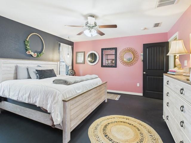 1675 Meadowview Street Athens, TX 75752 - Photo 16 of 40 a bedroom with a bed and dresser