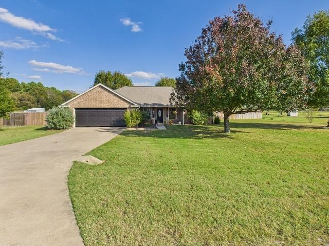 1675 Meadowview Street Athens, TX 75752 - Photo 2 of 40 a view of a house with a yard