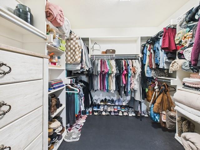 1675 Meadowview Street Athens, TX 75752 - Photo 22 of 40 a view of walk in closet with clothes