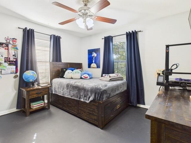 1675 Meadowview Street Athens, TX 75752 - Photo 26 of 40 a bedroom with a bed dresser and a window