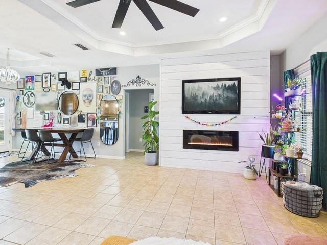 1675 Meadowview Street Athens, TX 75752 - Photo 10 of 40 a living room with furniture and a flat screen tv