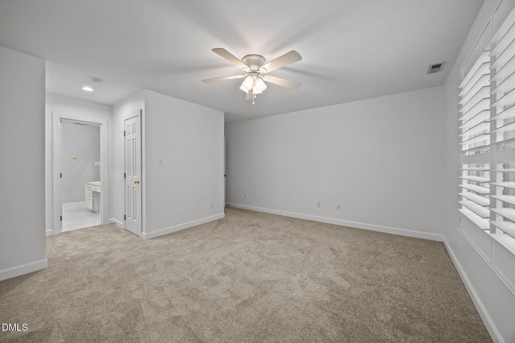 3409 Sir Colleton Court Raleigh, NC 27612 - Photo 13 of 25 an empty room with windows and fan