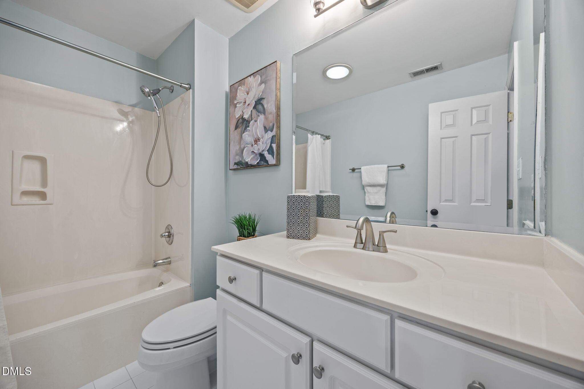 3409 Sir Colleton Court Raleigh, NC 27612 - Photo 19 of 25 a bathroom with a sink a toilet and a bathtub