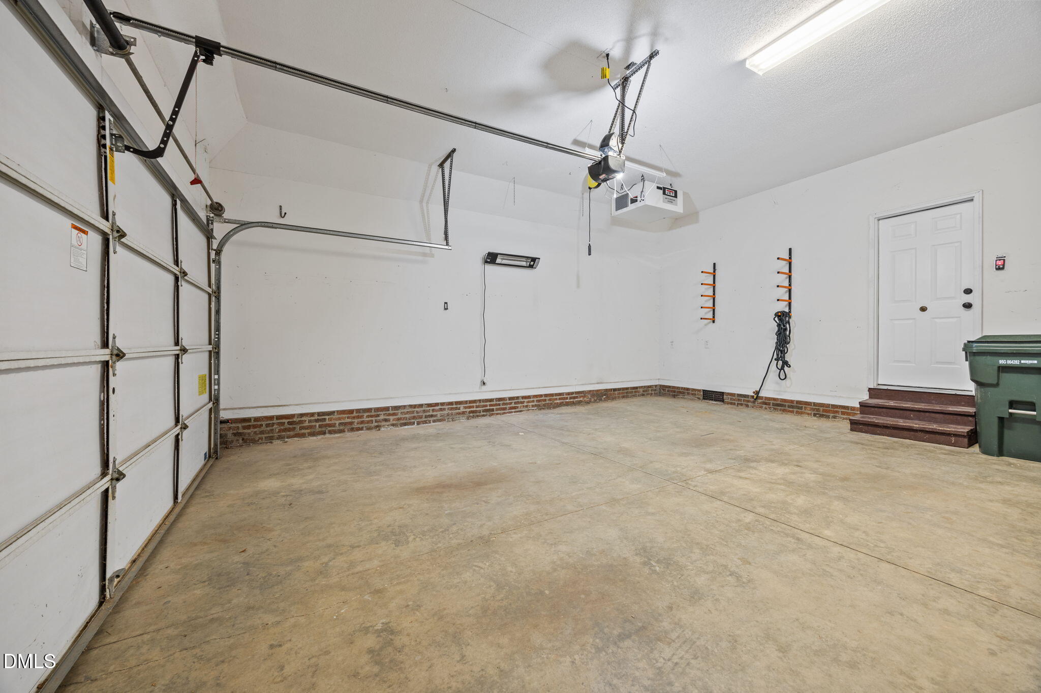 3409 Sir Colleton Court Raleigh, NC 27612 - Photo 20 of 25 a view of a room with rack and white walls