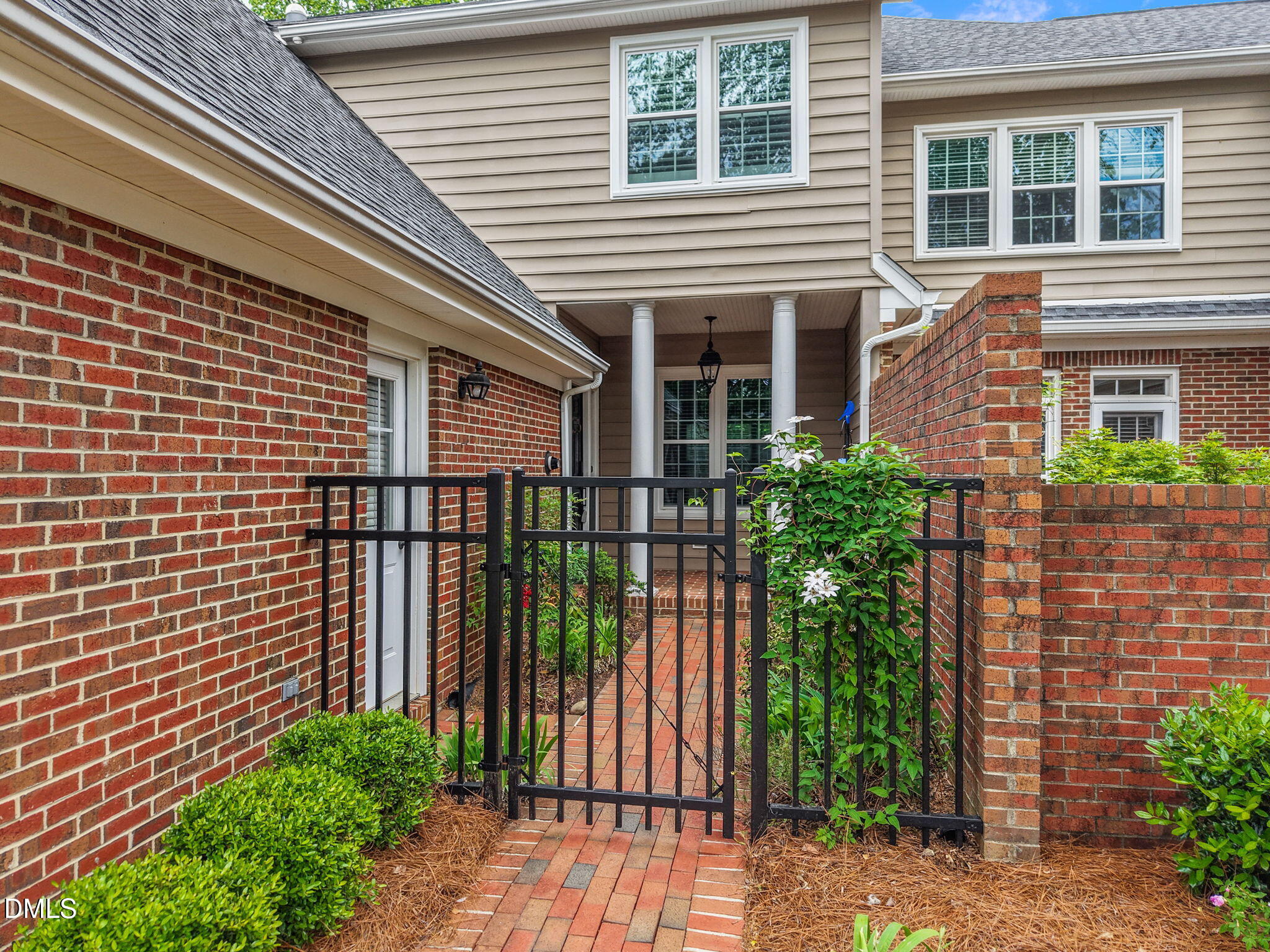 3409 Sir Colleton Court Raleigh, NC 27612 - Photo 2 of 25 a view of a house with a flower garden