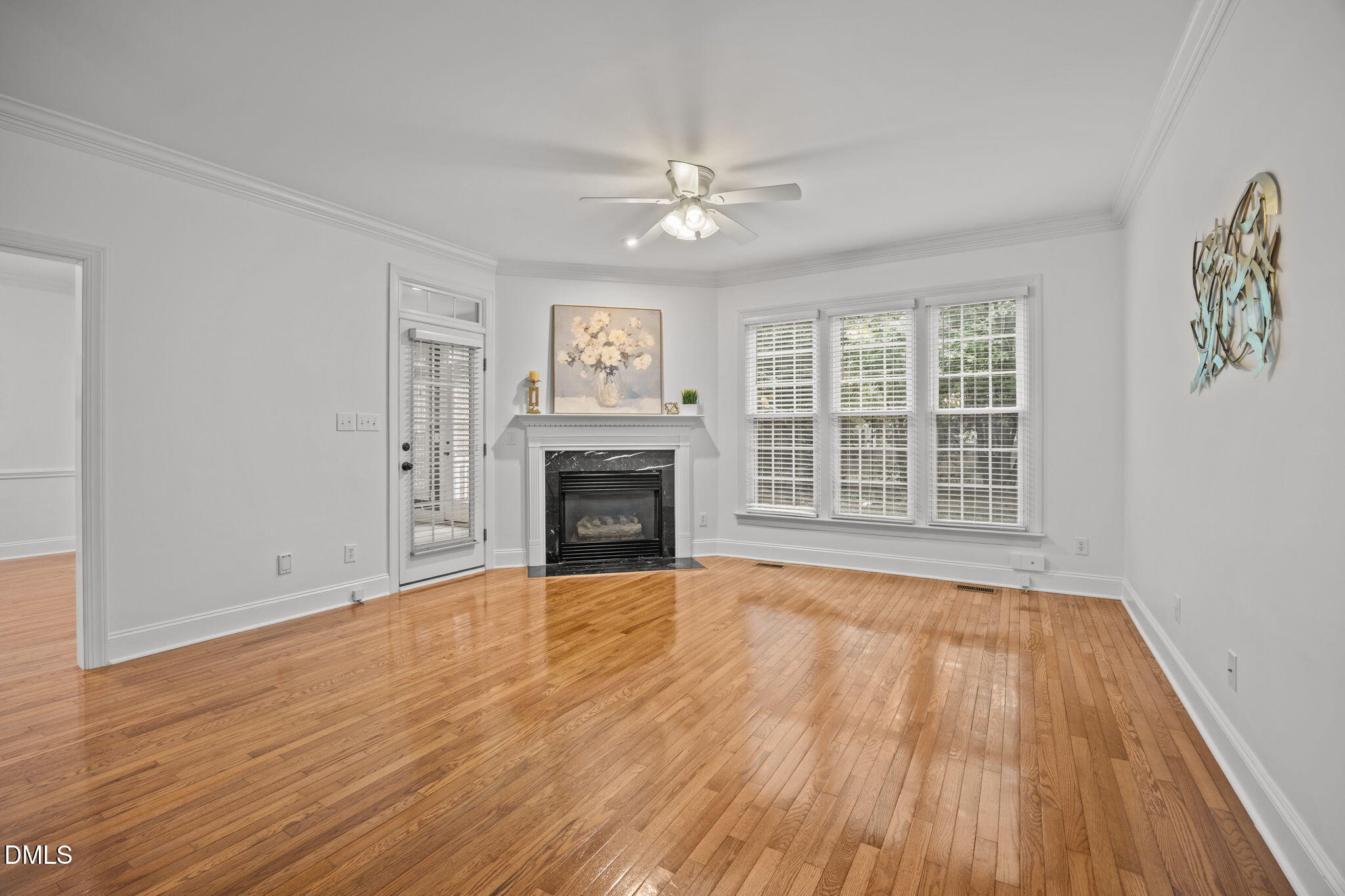 3409 Sir Colleton Court Raleigh, NC 27612 - Photo 5 of 25 wooden floor fireplace and windows in an empty room