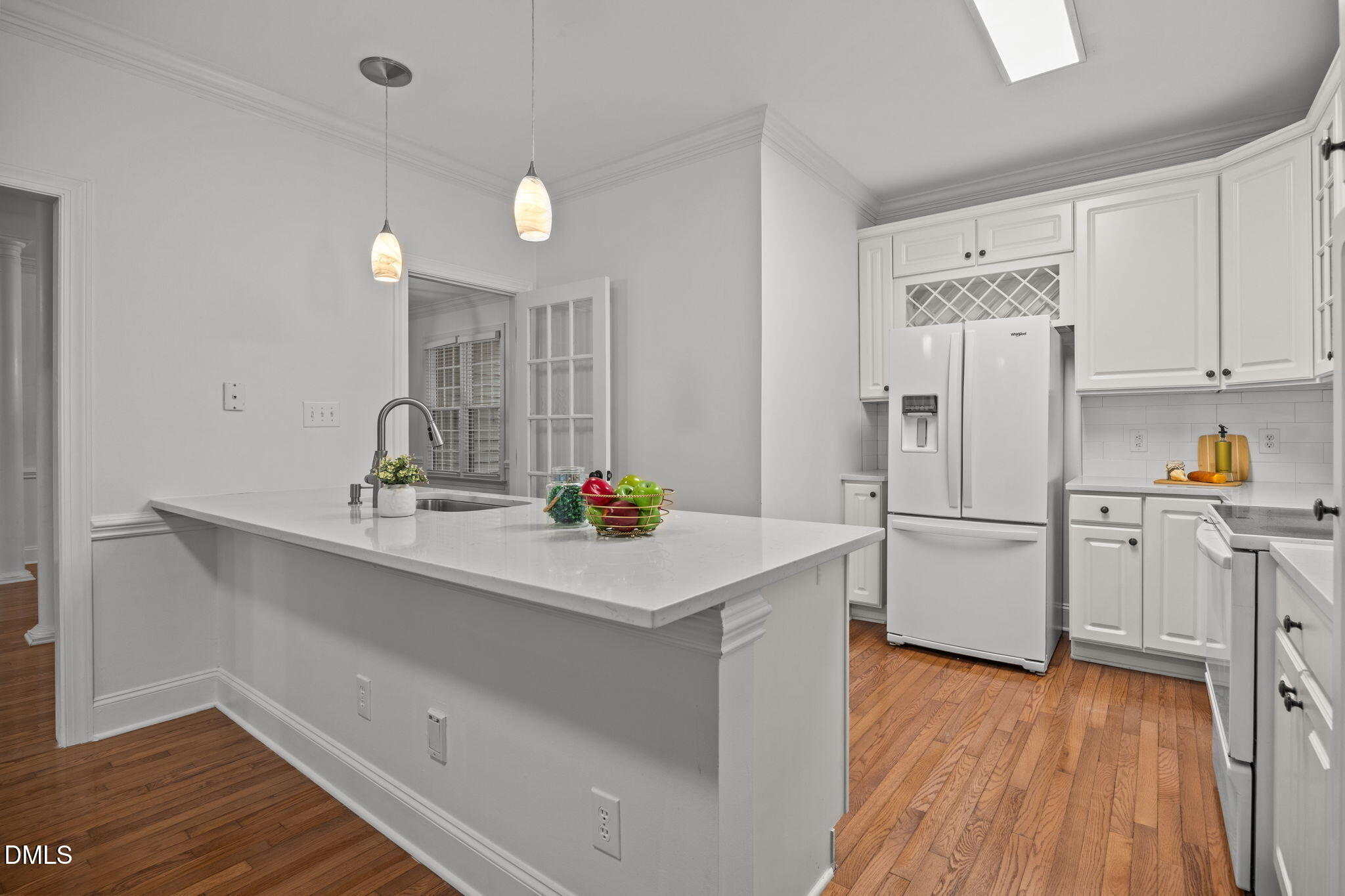 3409 Sir Colleton Court Raleigh, NC 27612 - Photo 8 of 25 a kitchen with a sink appliances and cabinets