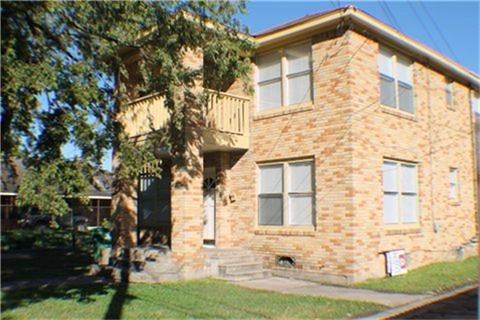 5017 Pease Street, Unit B Houston, TX 77023 - Photo 1 of 8 a front view of a house with a yard