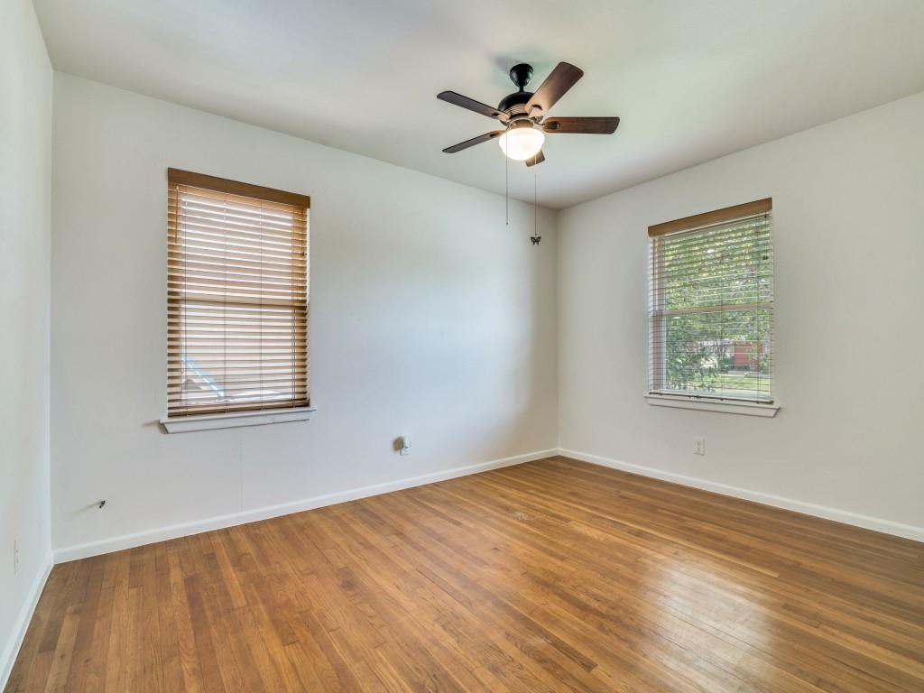2315 Inadale Avenue Dallas, TX 75228 - Photo 28 of 36 a view of an empty room with wooden floor and a window